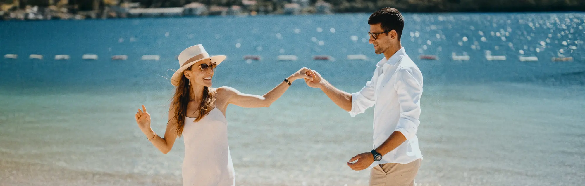 A couple holding hands on the Montenegrin coast
